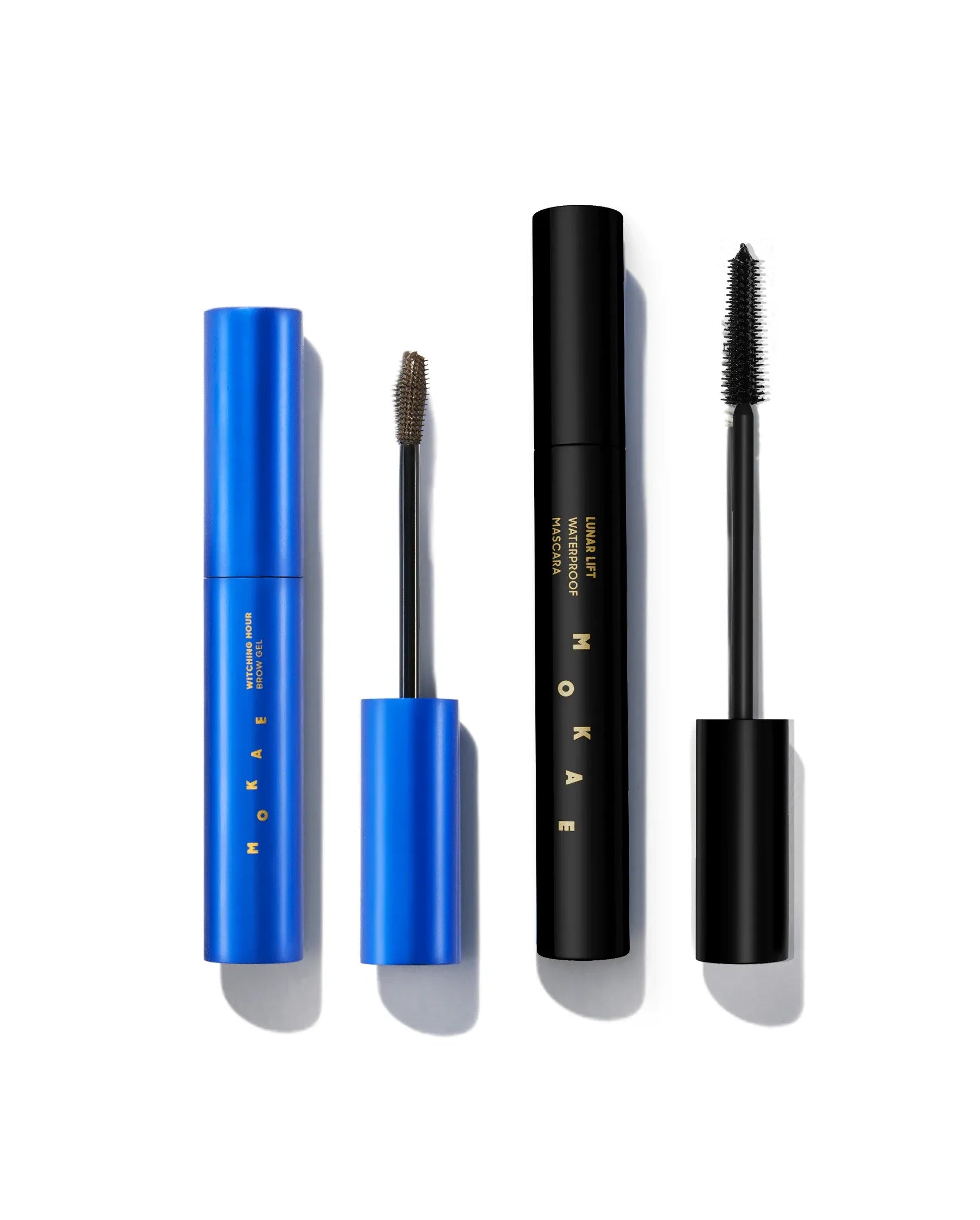 Set of mascara products with blue and black packaging on a white background