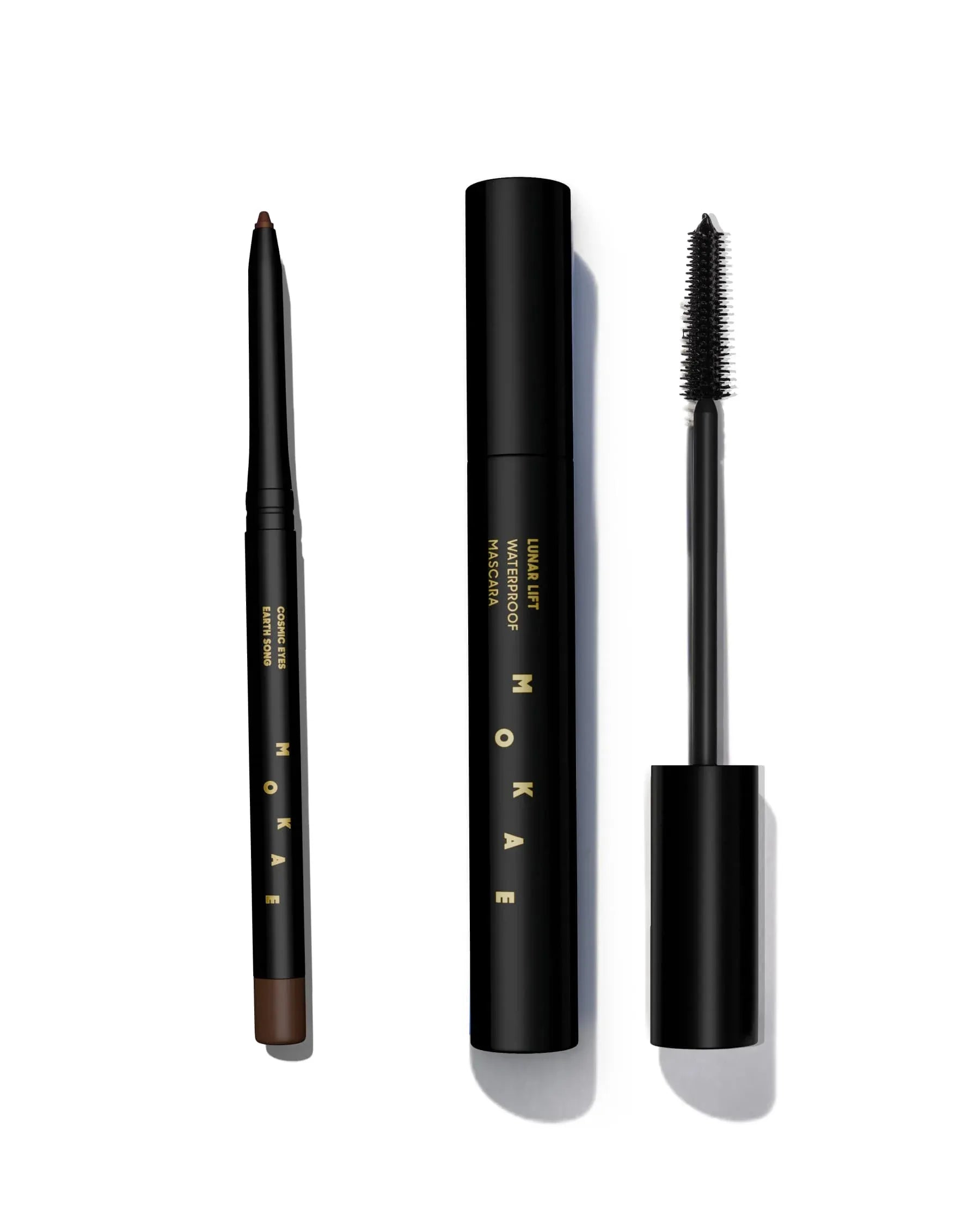Set of MOKAE eyebrow pencil, mascara, and eyeliner on a white background